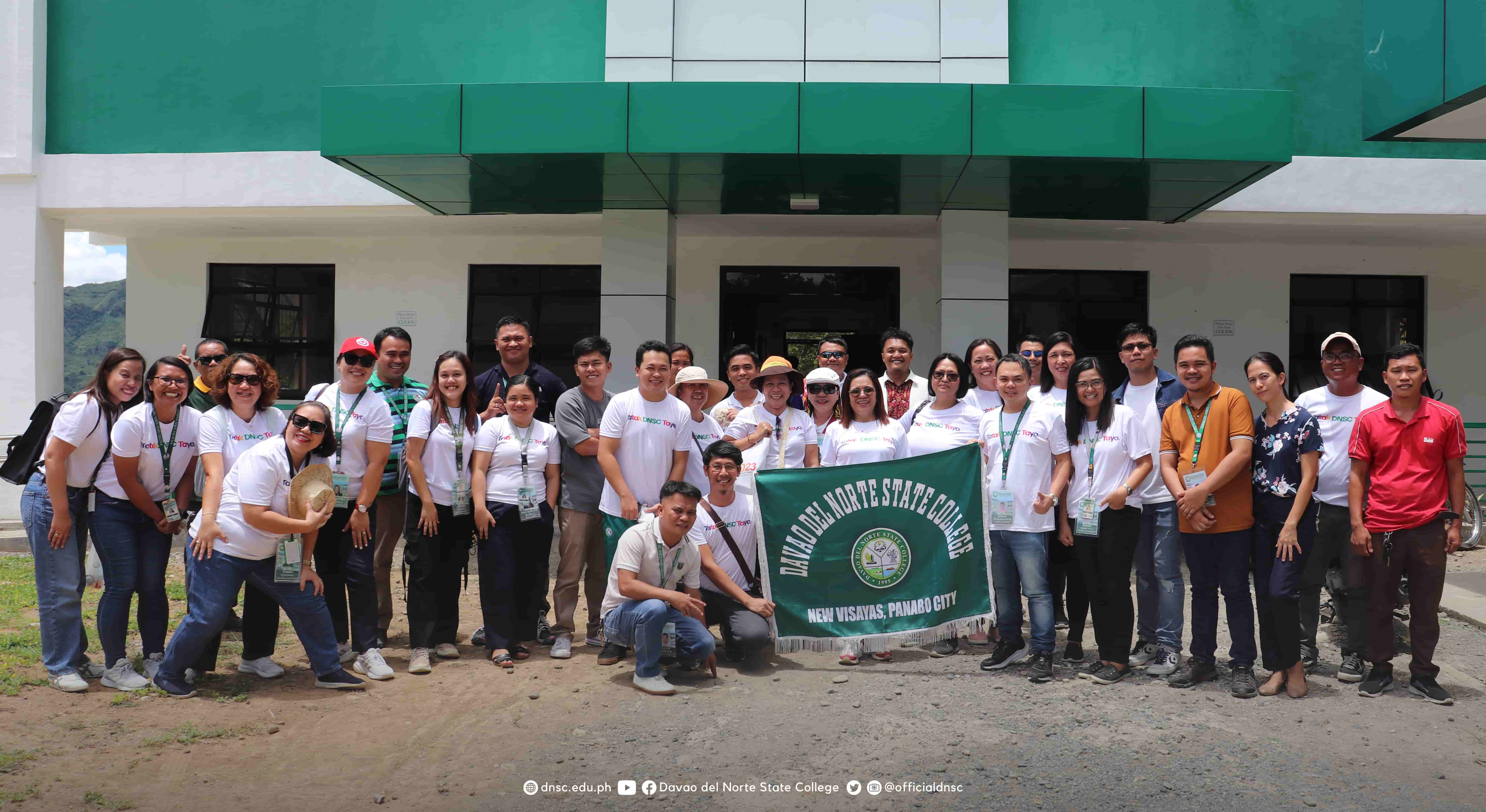 DNSC personnel take a moment to pose for a photo during the tree planting activity. Photo by Randy Magayon, DNSC PIO.